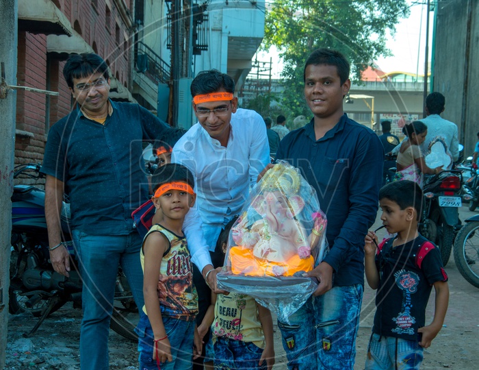 Devotees Purchasing Lord Ganesh Idols From Vendor Stalls For Ganesh Festival