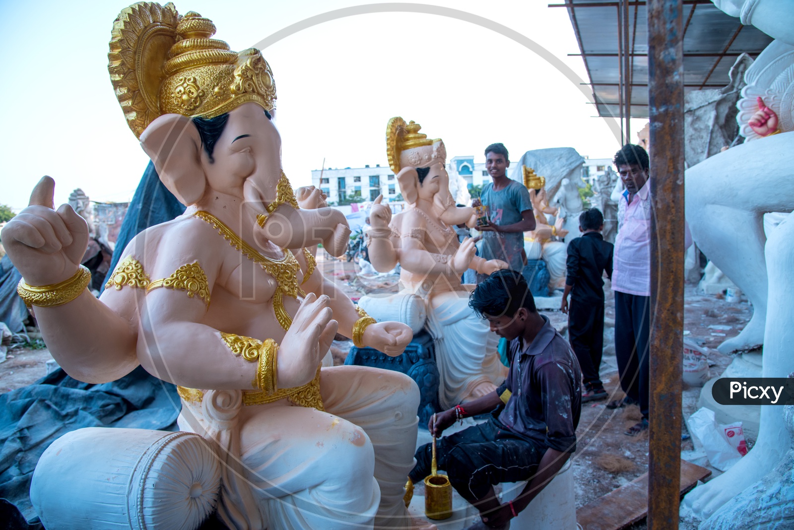 Ganesh Idols In Making  Artists Performing Final Detailing For Lord Ganesh Idols In Workshops For Ganesh Festival Or Ganesh Chathurdhi or Vinayaka Chavithi