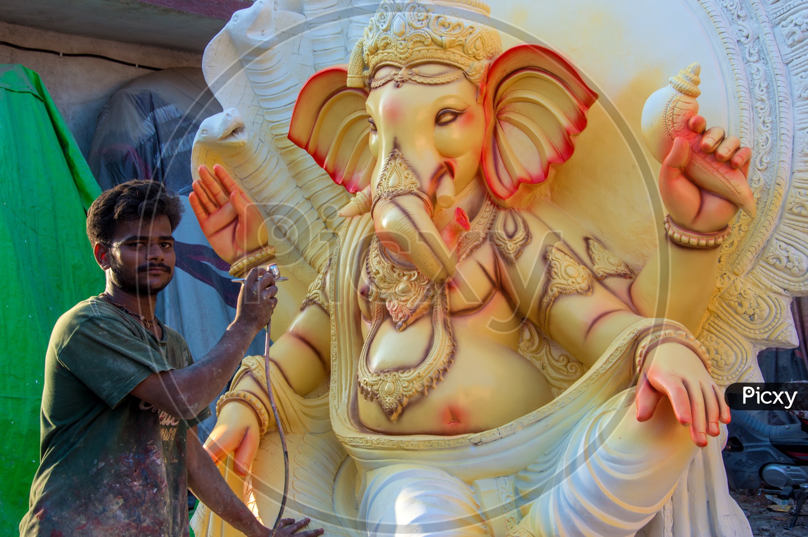 Ganesh Idols In Making  Artists Performing Final Detailing For Lord Ganesh Idols In Workshops For Ganesh Festival Or Ganesh Chathurdhi or Vinayaka Chavithi