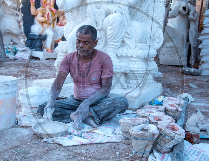 Artist Making Lord Ganesh Idols in Workshop For Ganesh Festival  or Ganesh Chathurdhi