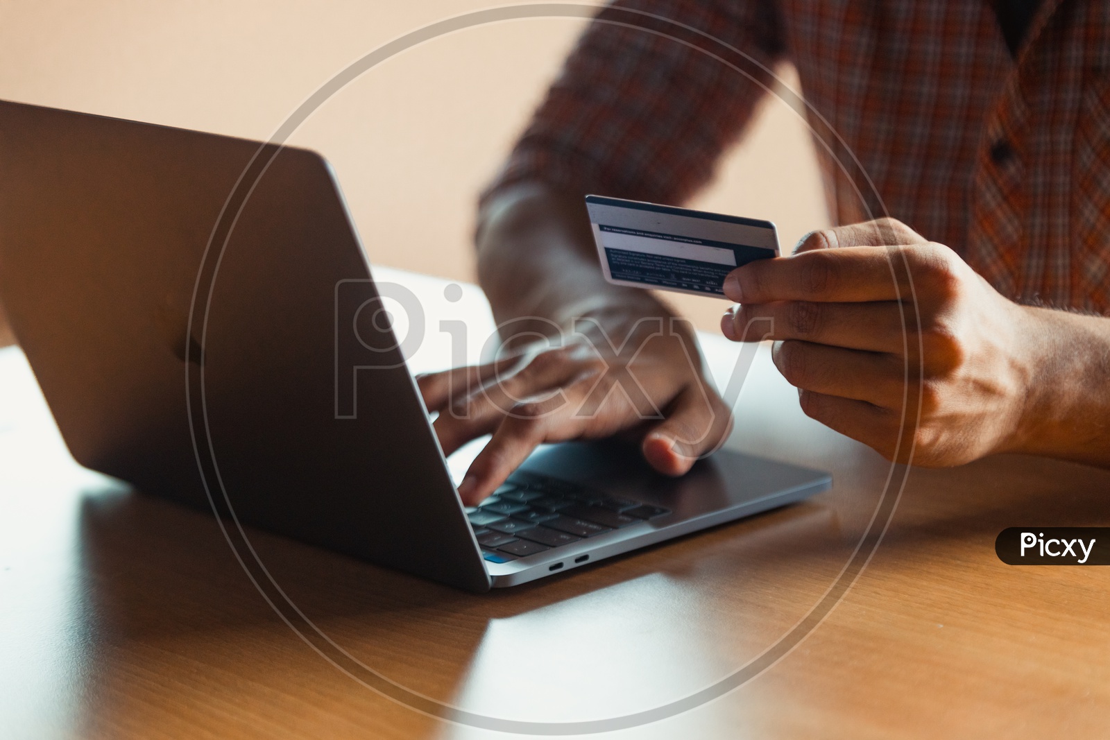 Online Payments Or Online Shopping  A Young Man Using Debit or Credit Card For Online Transaction or Payments in Laptop computer