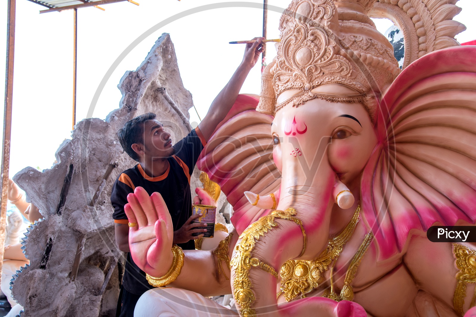Ganesh Idol Making In Workshops    An Artist Giving  Finishing To Lord Ganesh Idols Made Of Plaster Of Paris  In Workshops
