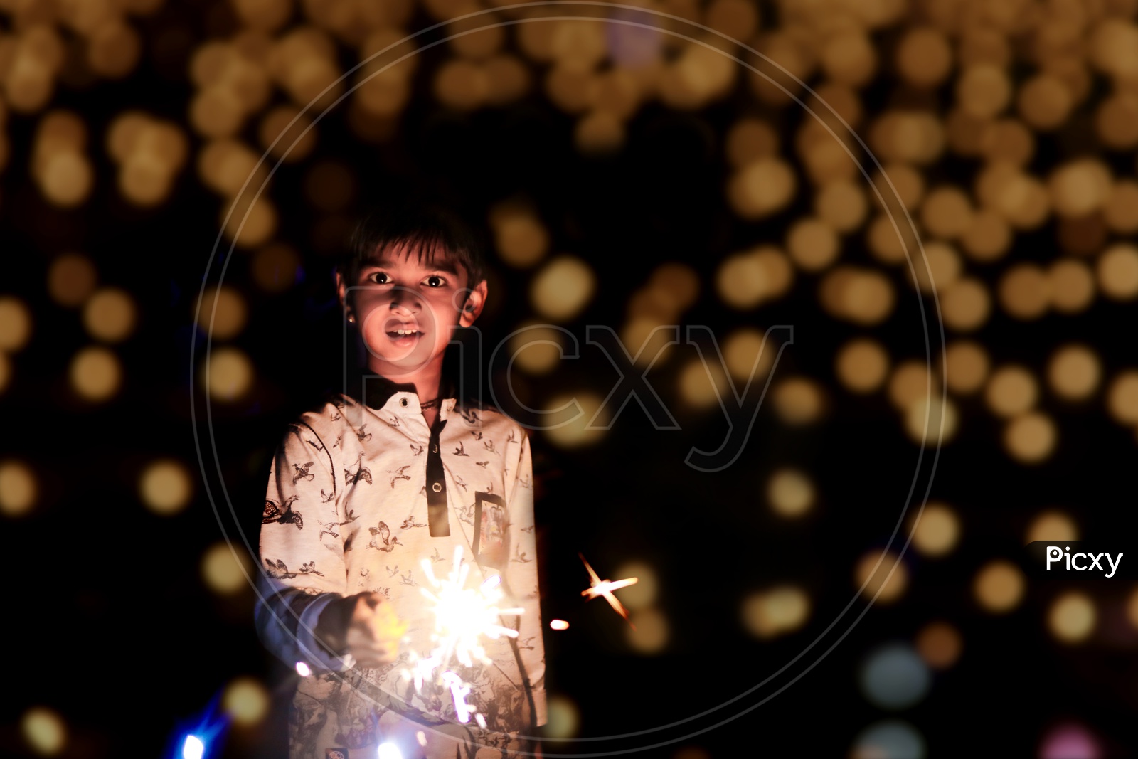 Indian Boy Or  Kid Celebrating Diwali Festival wit Crackers