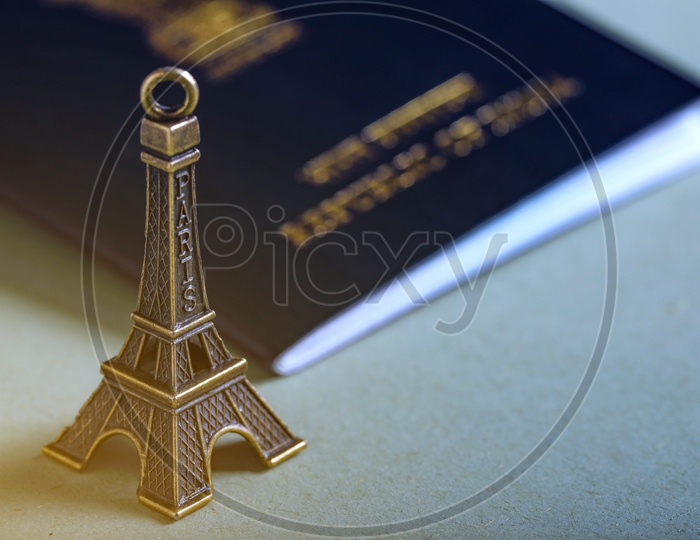 Travel Concept  Indian Passport And Eiffel Tower Miniature