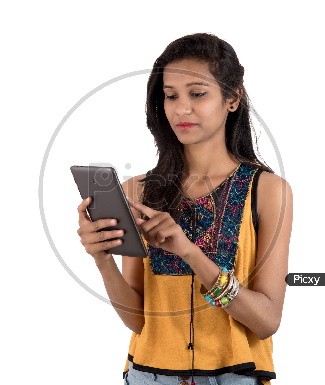 Young  Indian Girl Using  Tab Or Tablet Gadget on an Isolated  White Background