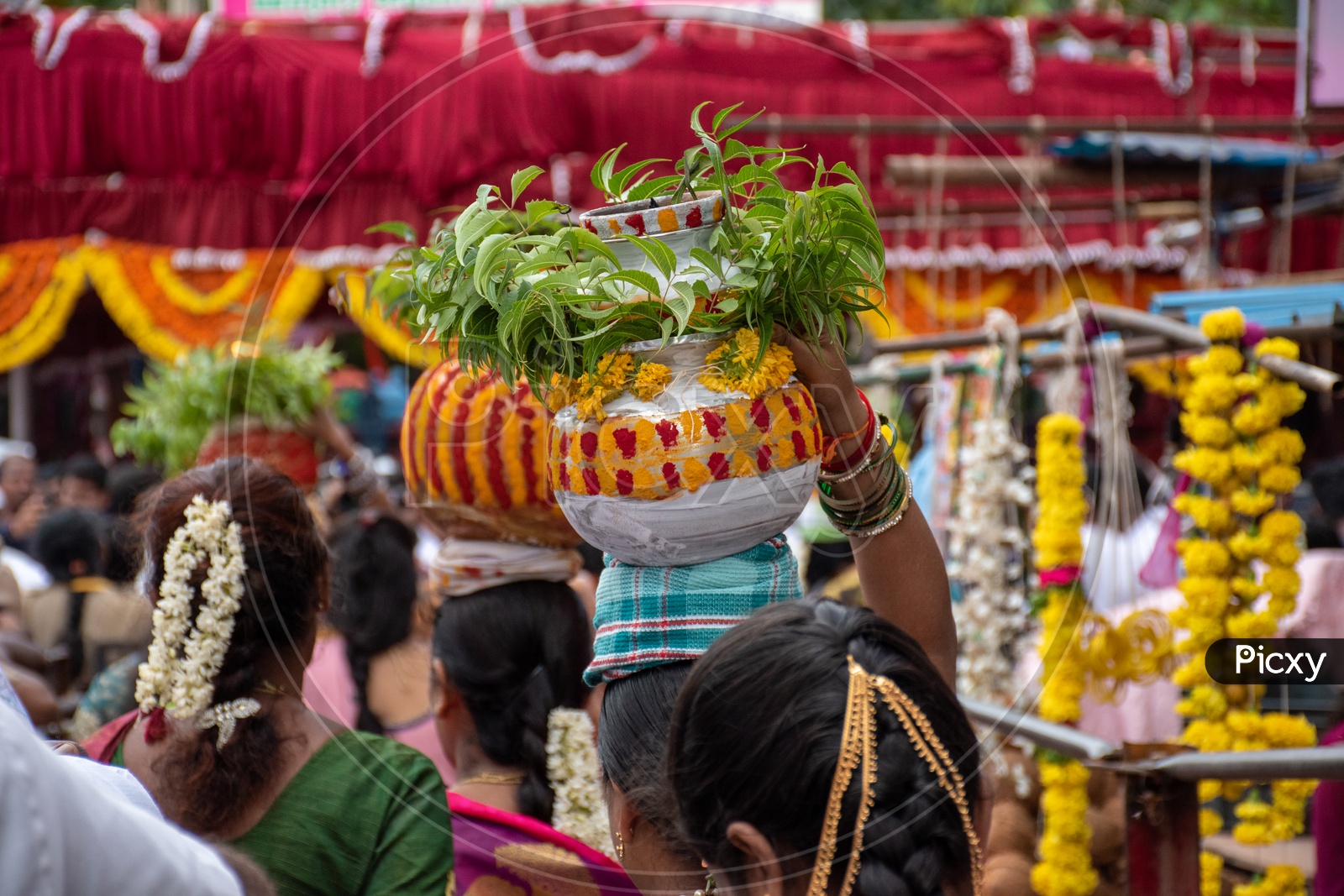 Women offering bonalu at Mahankali Temple, secunderabad on the eve of bonalu festival.