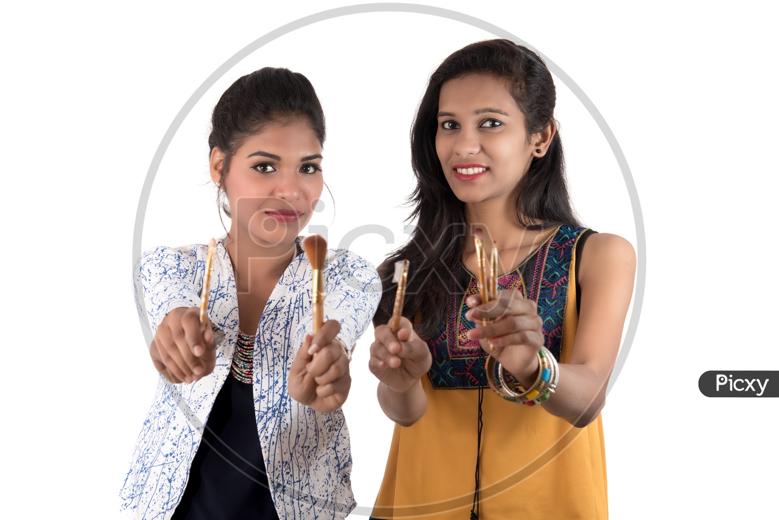 Beautiful Young girls  Holding Makeup brushes in Hand With Smile Face On an isolated White Background