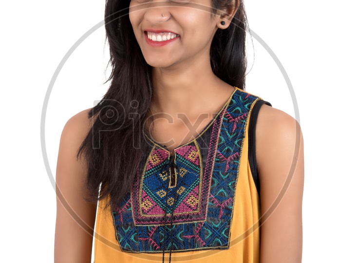 Young Indian Girl  Posing  With a Smile Face On an Isolated White Background
