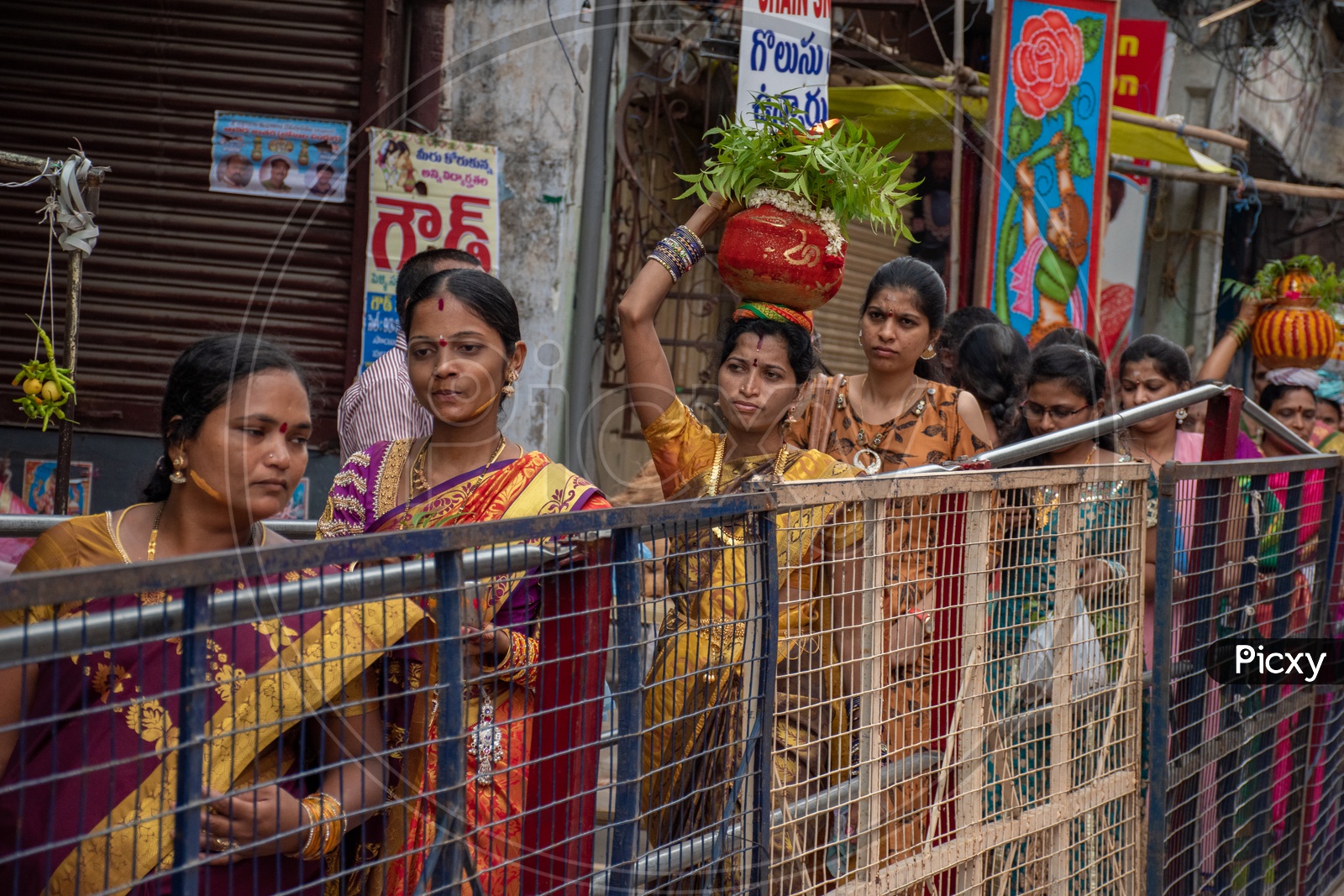 Women waiting in queue to offer bonalu at Mahankali Temple, secunderabad on the eve of bonalu festival.