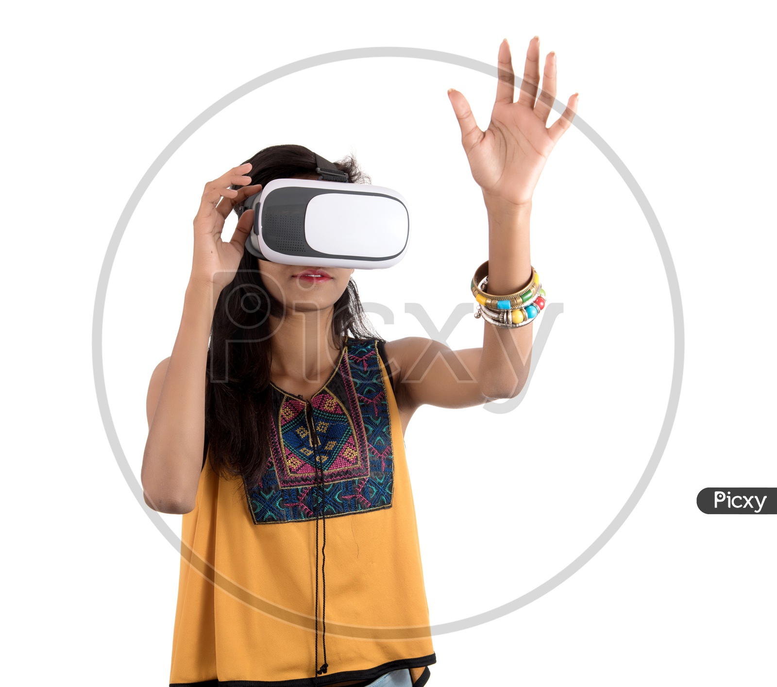 Beautiful Girl Looking Through  VR  Device  or   Young Girl Wearing  Virtual Reality  Goggle Headset  on an Isolated White Background