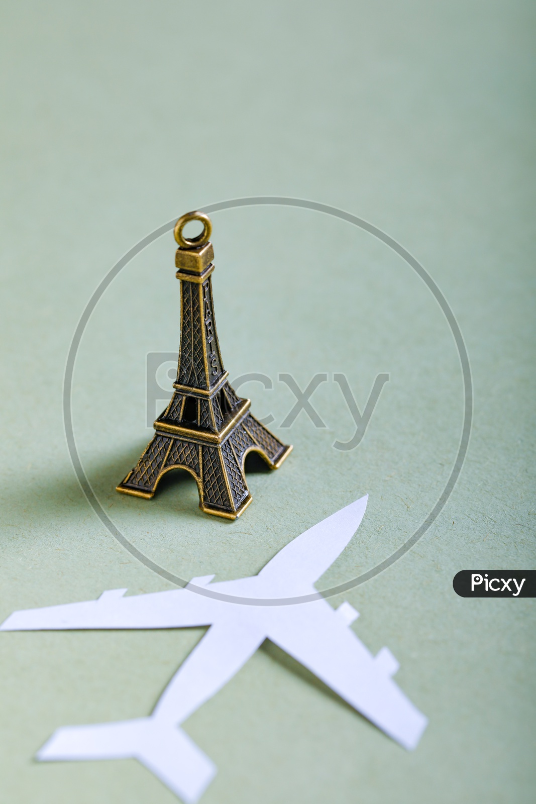 Travel Concept   Paper Airplane and Eiffel Tower Miniature