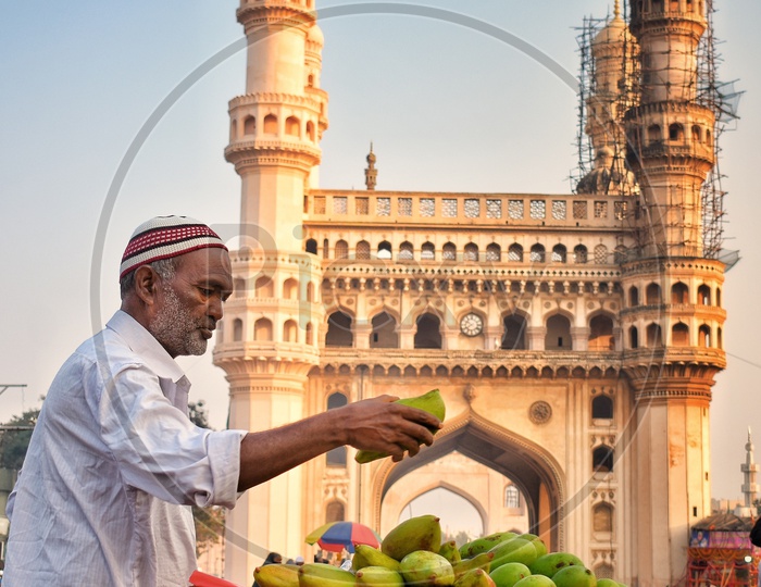 A mango vendor selling Mangoes at charminar