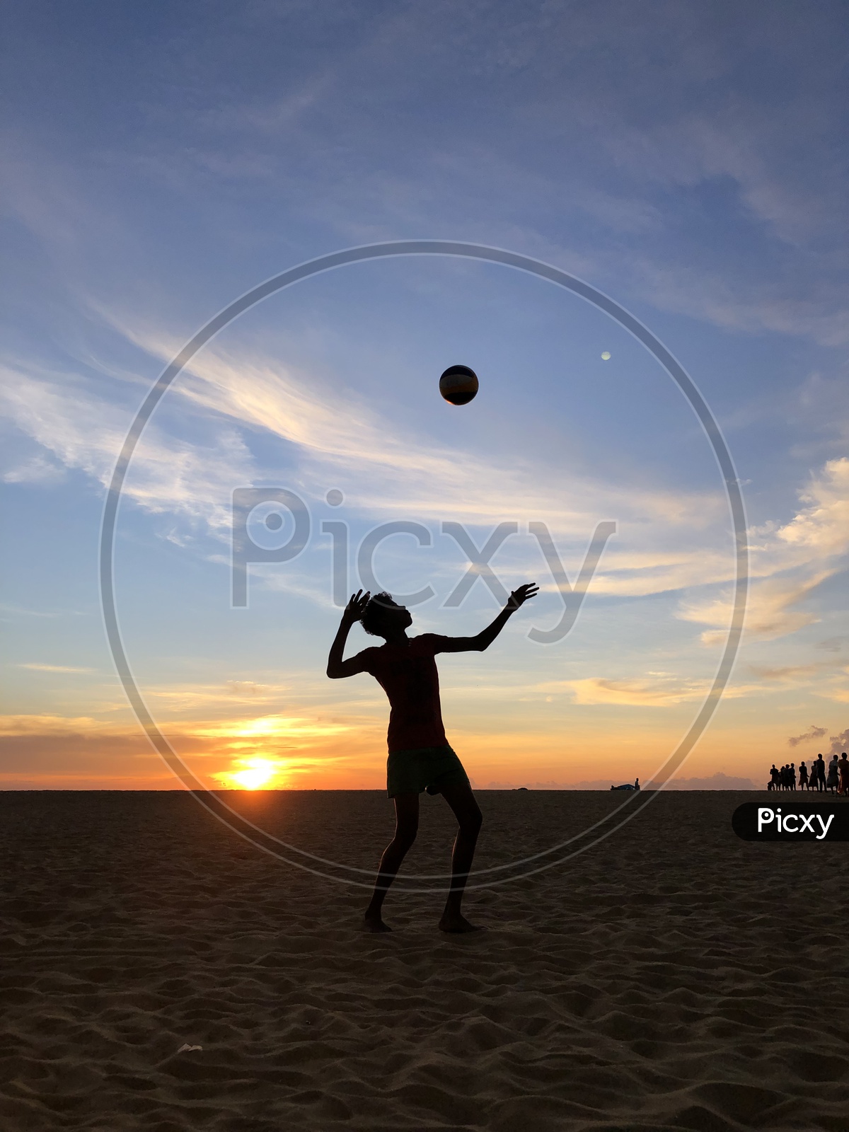 Silhouette Of a Man Playing Beach Volleyball