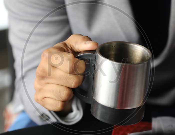Man Holding a Coffee Cup