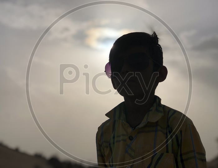 Silhouette Of a Young Indian Boy