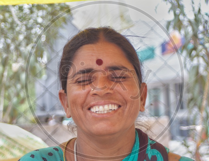 Portrait Of an Woman Vendor With Smile Face In a Market