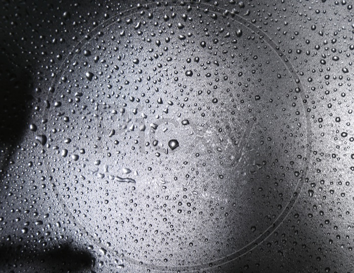 Texture And Patterns Of Water Droplets On a Glass Shield