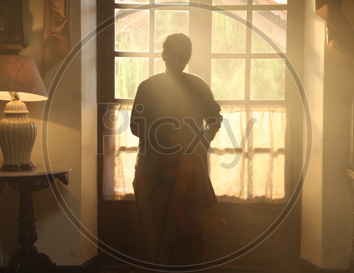 Silhouette Of an Woman At a House Window