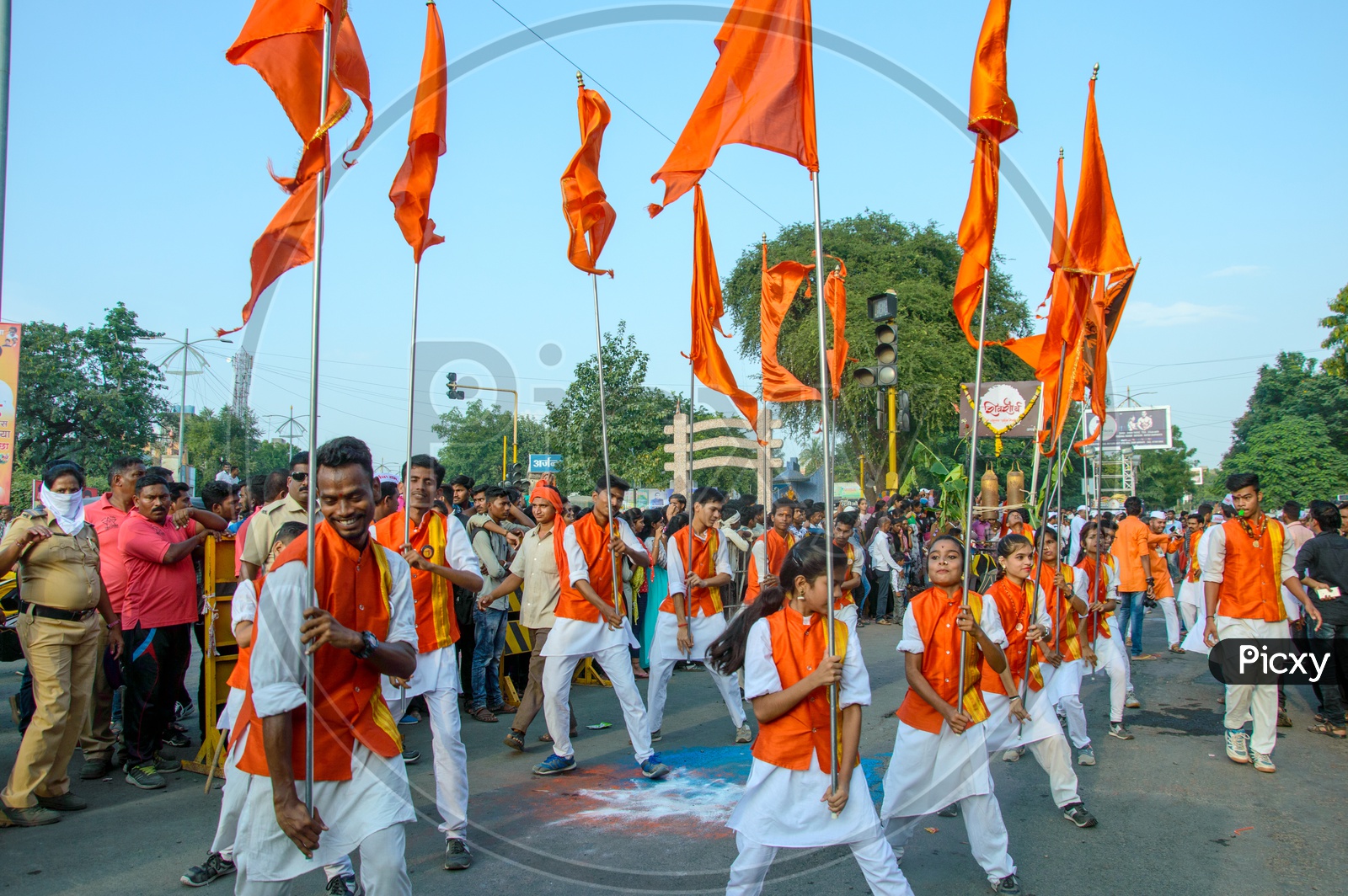 Image of A Group of Man Performing And Dancing On the Streets Holding ...