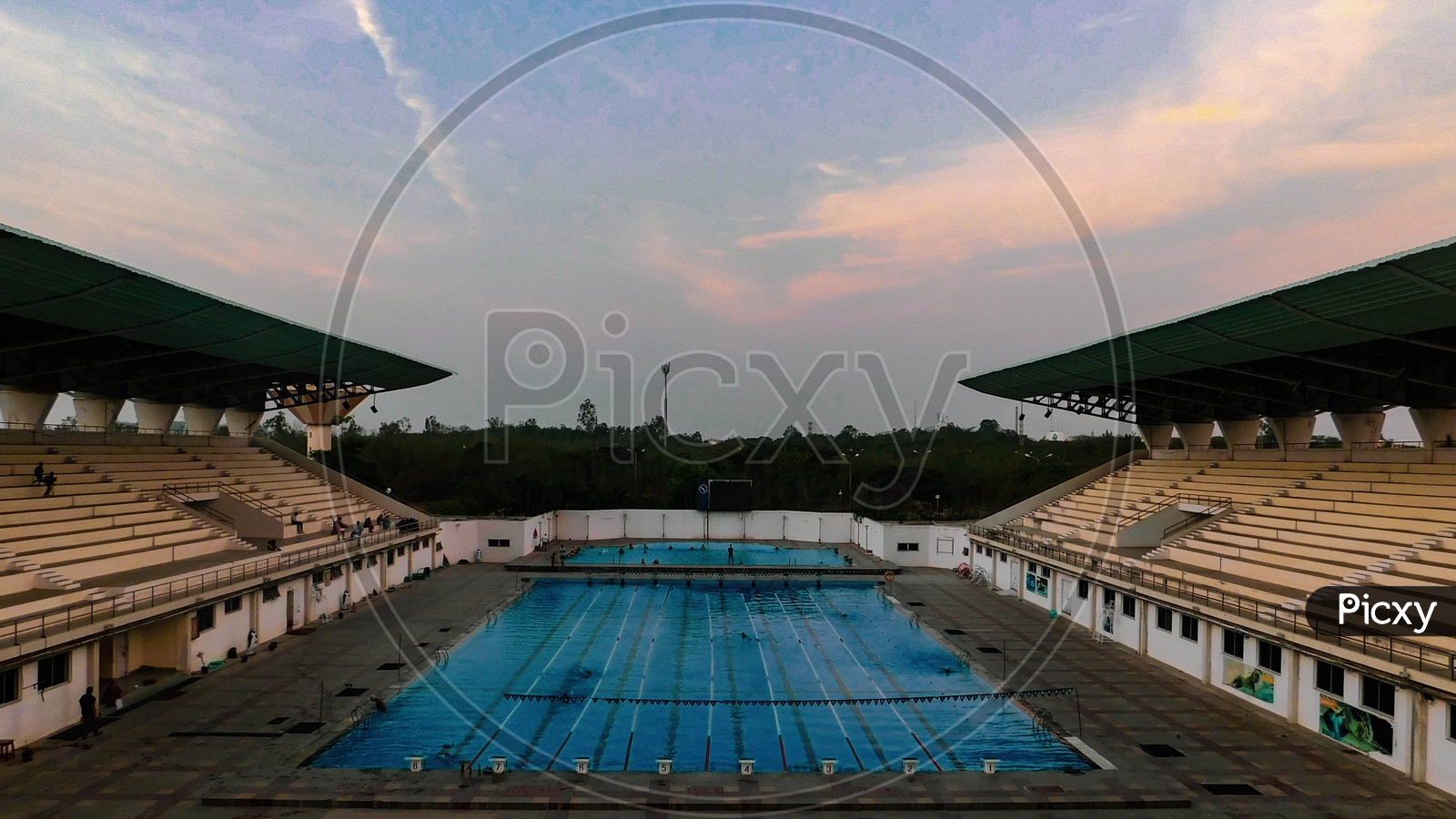 Olympic size pool shot with spectator gallery in frame