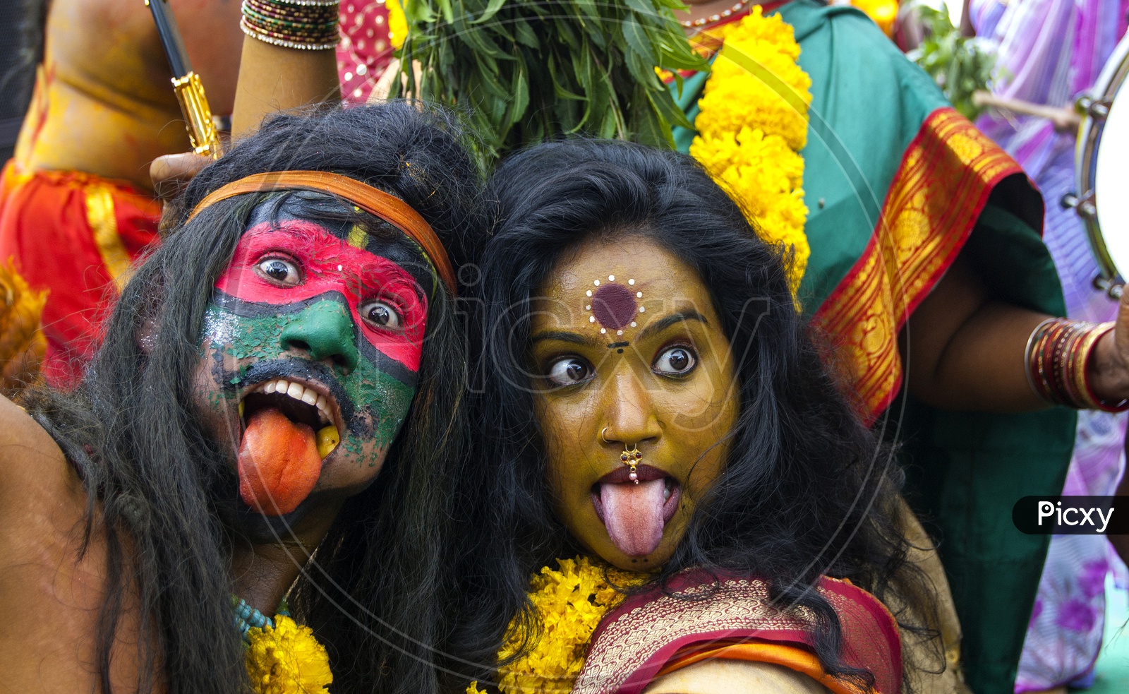Modern extension to festivities Selfie style pose by a Potharaju and devotee women in action!