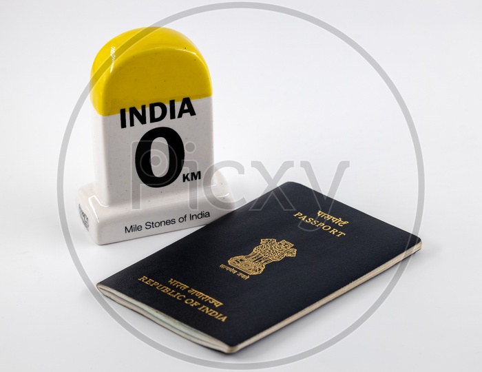 Travel Concept  , Indian Passport With India Mile Stone  on an Isolated White Background