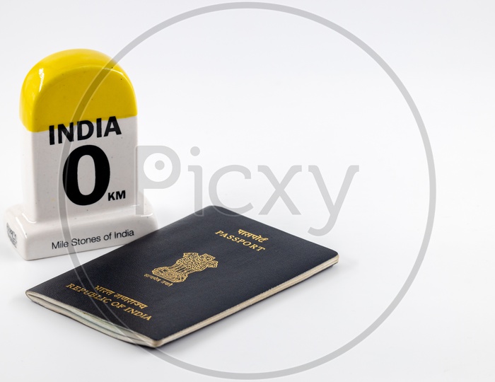 Travel Concept  , Indian Passport With India Mile Stone  on an Isolated White Background