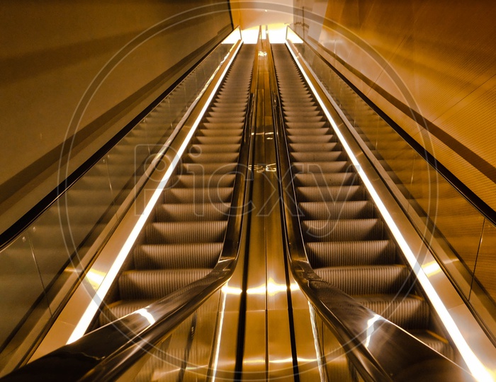 Escalator with yellow lights