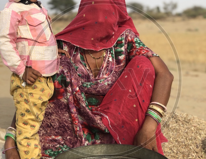 A Young Mother With Her Son in Rajasthan Attire