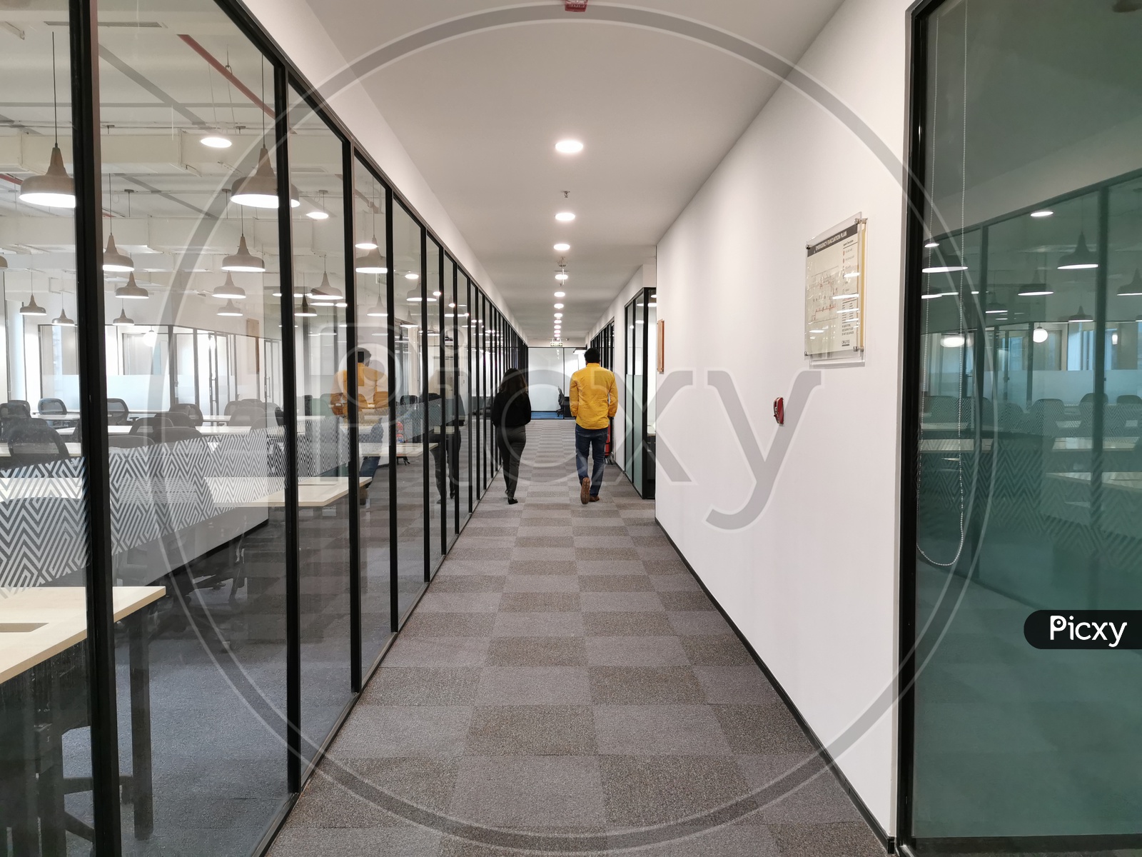 Employees Walking Along The Corridors Of CoWrks Office Working Spaces