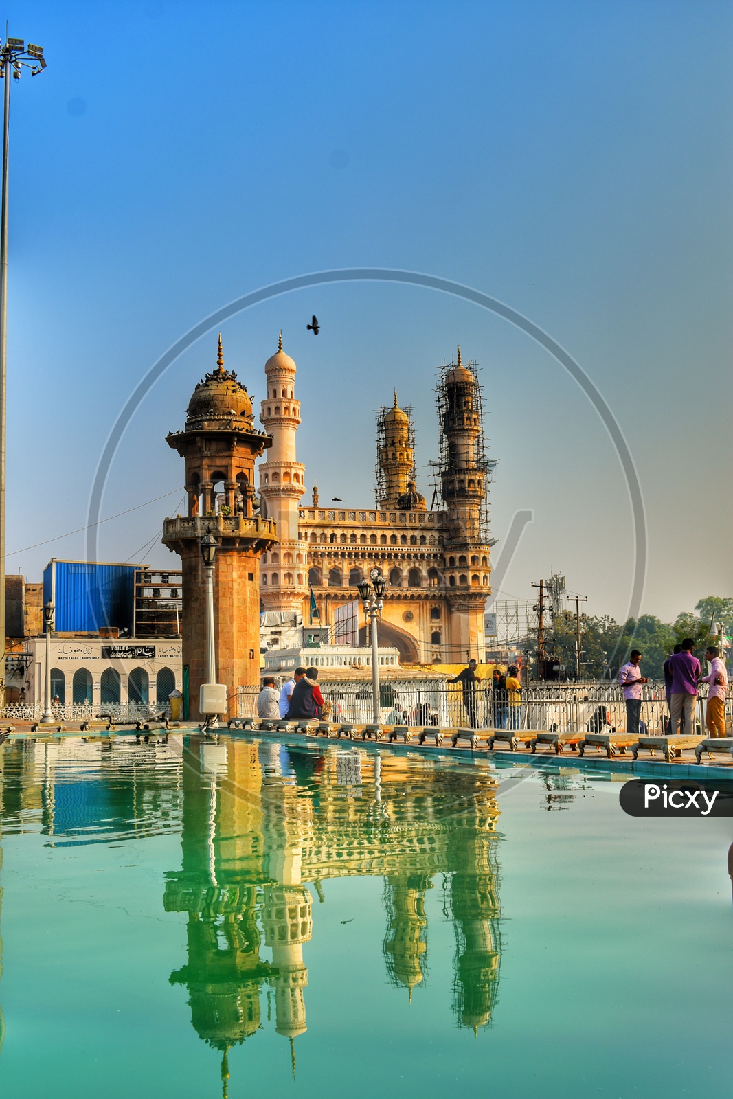 Reflection of Charminar from the holy Mecca Masjid