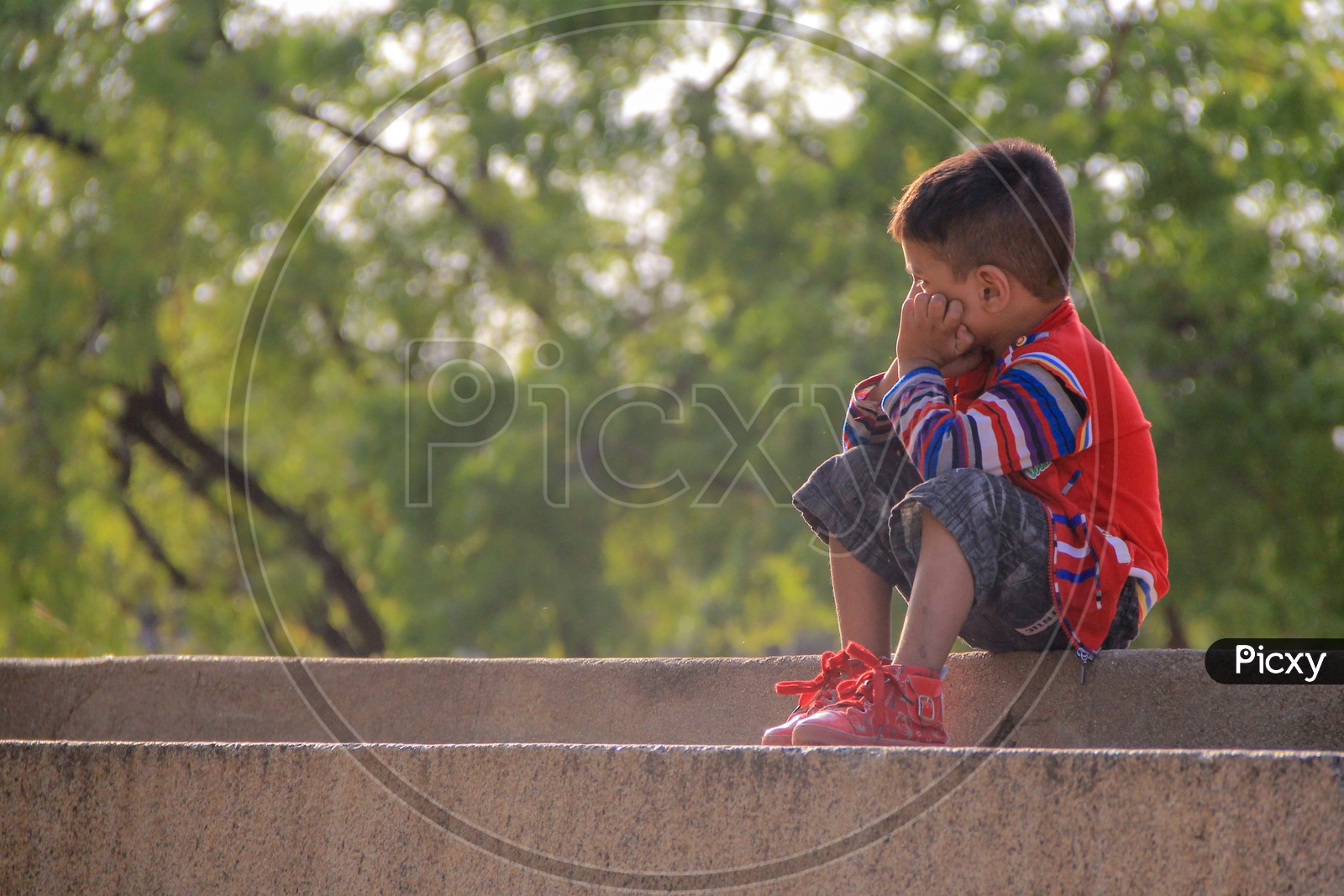 Depressed or Sad Unhappy Child sitting