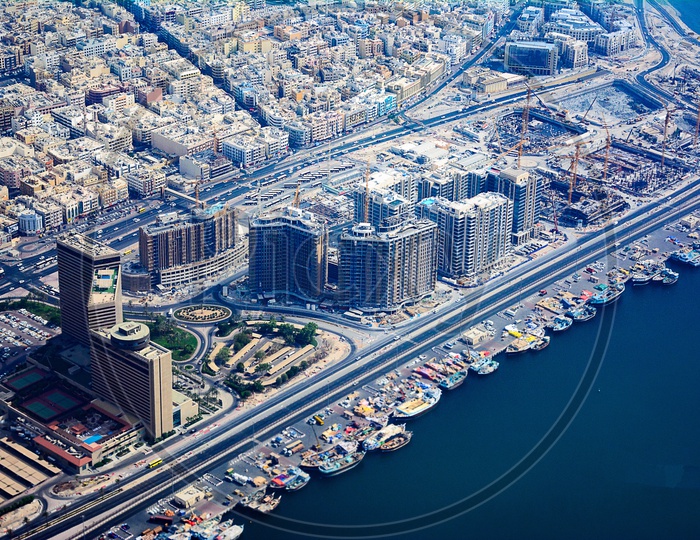 Aerial View Of  Dubai City With High Rise Buildings And River