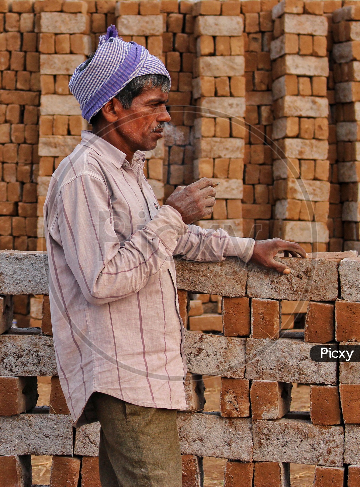 Smoking kills  , Daily Labor Smoking  Beedi at A Brick Klin