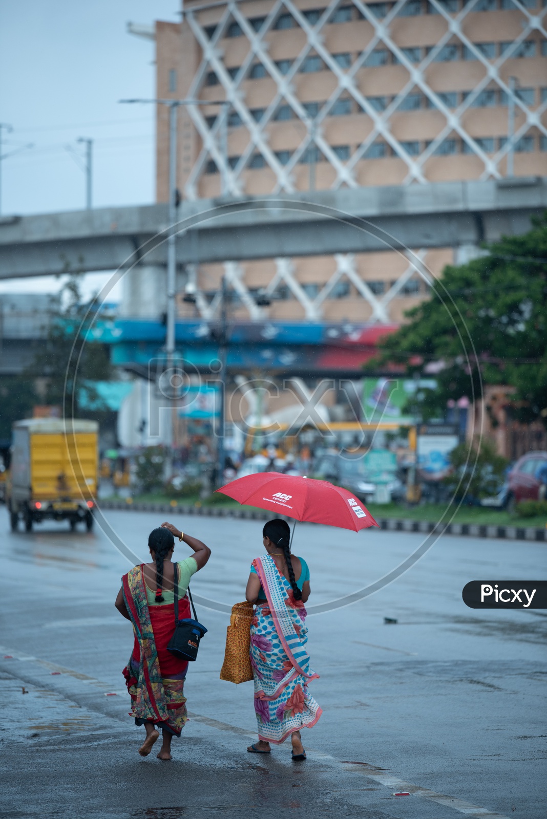 Indian Woman In Rain Under Umbrella On Hi-tech City Roads  Near Cyber Towers