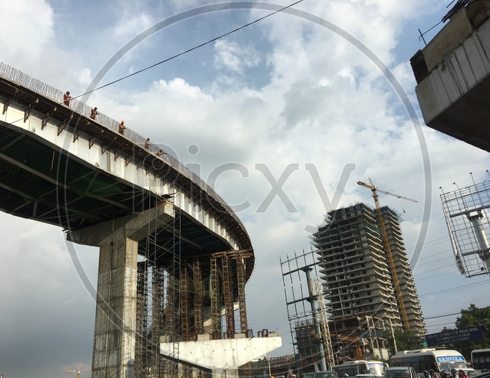 Workers on a Under construction Flyover at Biodiversity Junction 