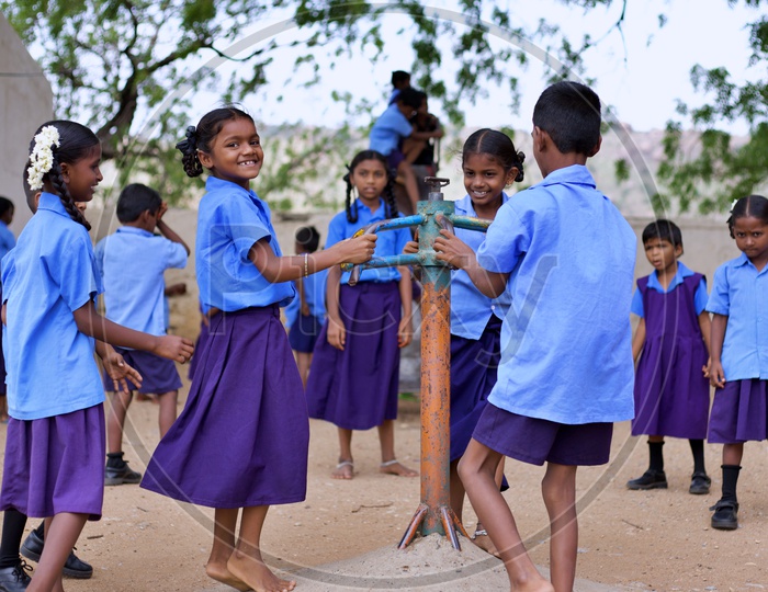Govt school students playing in ground.