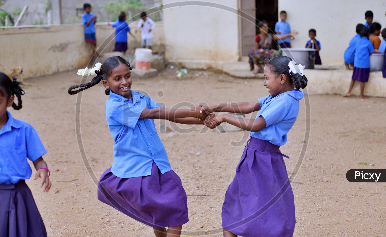 Girl students playing in playground.