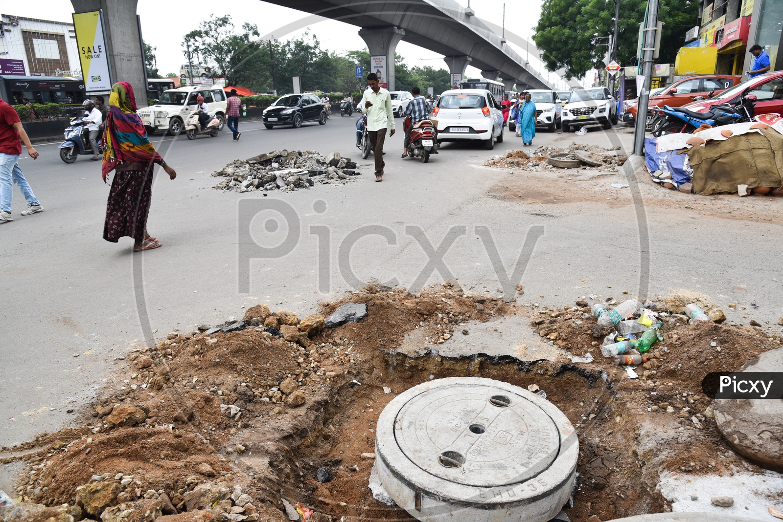 Potholes Made On  City Roads For The Renovation Of Drainage  Pothole Discs
