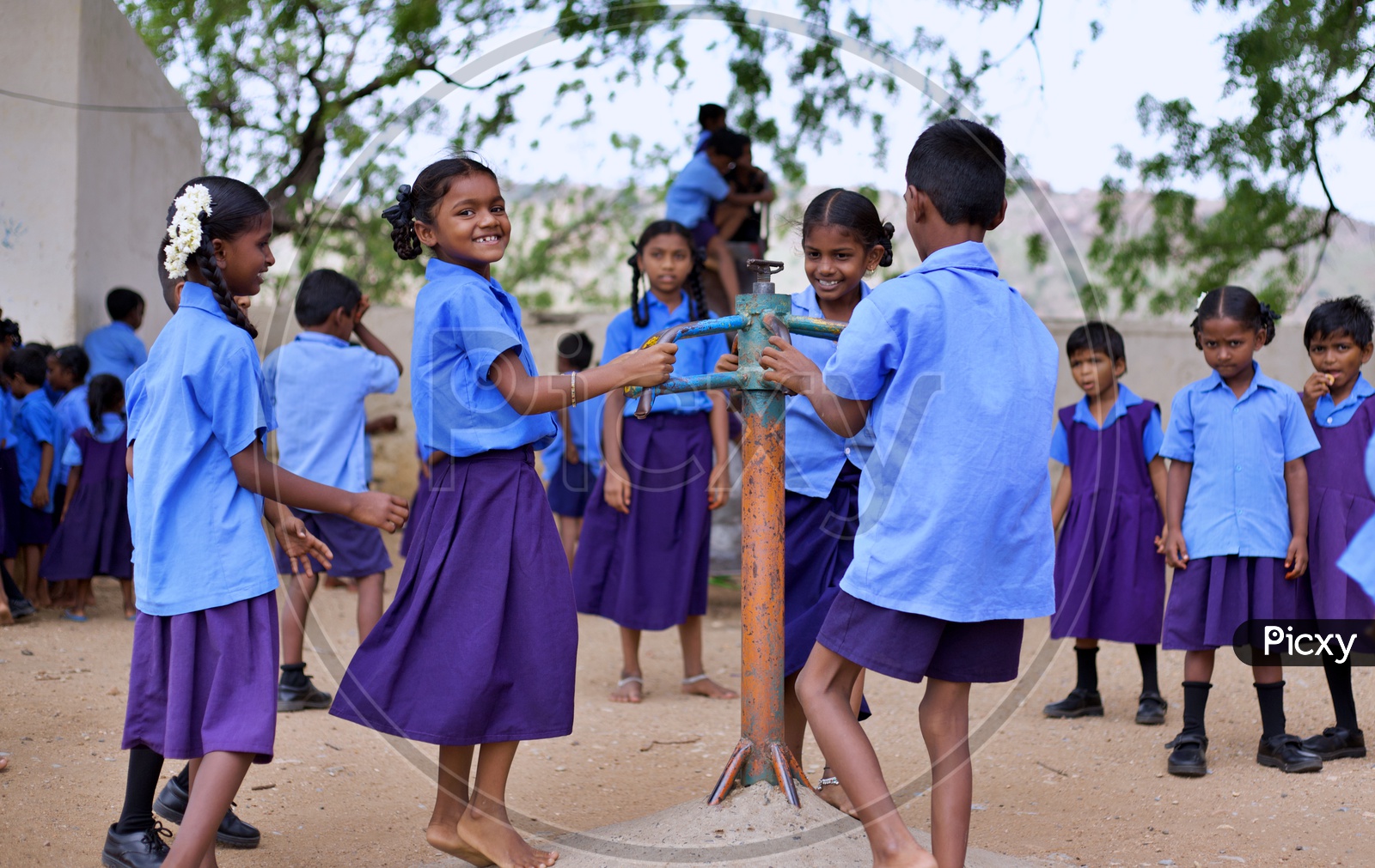 Govt school students playing in ground.