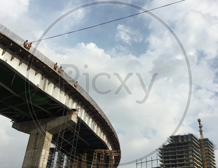 Workers on a Under construction Flyover at Biodiversity Junction 