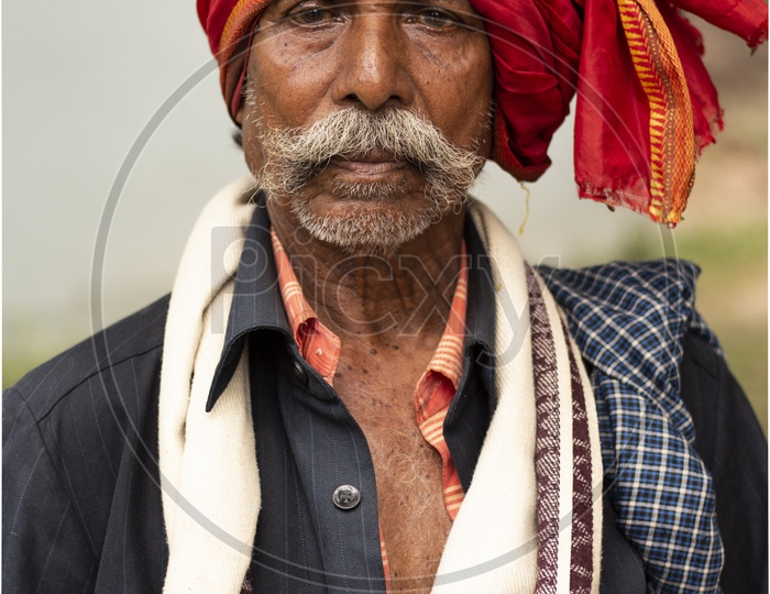 Elderly man with a turban and mustache