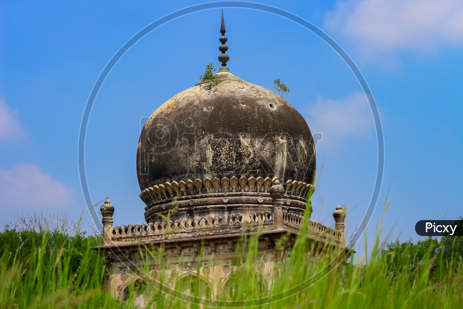 A View Of  Qutub Shahi Tombs With Blue Sky As Background