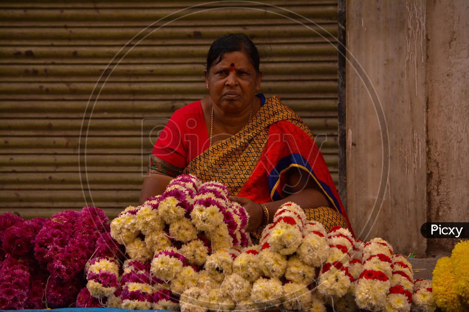 Woman Selling flowers