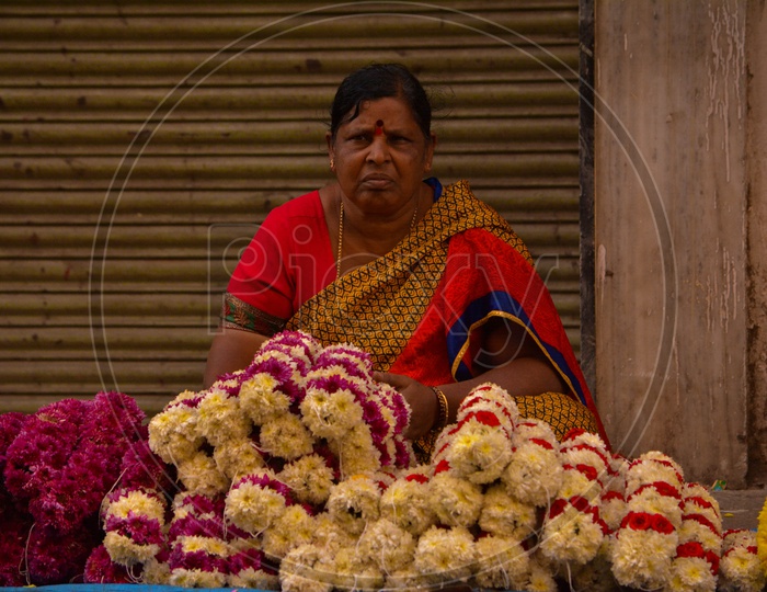 Woman Selling flowers