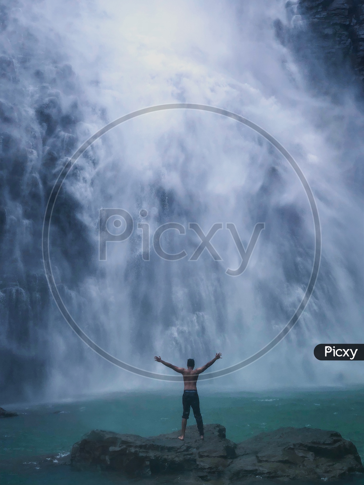 Man Enjoying waterfalls
