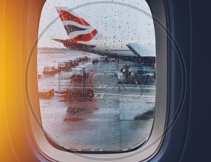 Flight Window Glass With Rain Droplets