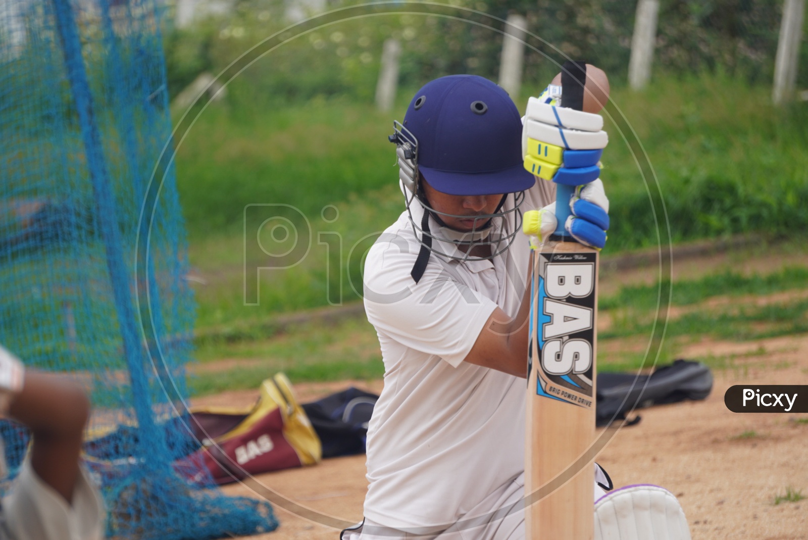 Image of Young Indian Boys In Cricket Coaching Cricket Practice