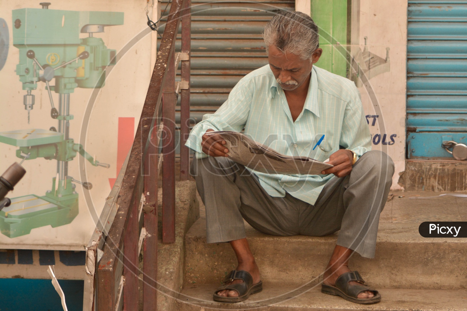 Man reading Newspaper on a sunday