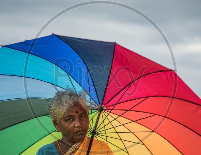A Fisher women with an umbrella
